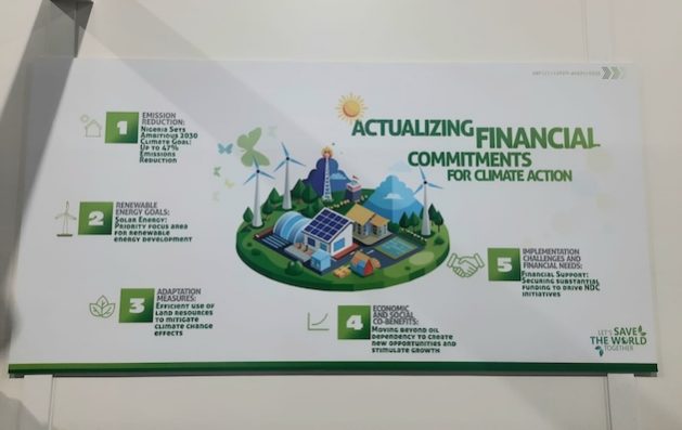 A poster at the Delegation Pavilion at COP29 highlighting the urgency of fulfilling financial commitments to drive impactful climate actions. Picture Credit: Aishwarya Bajpai/IPS