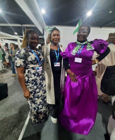 Women with scarves of green and white for Nigeria Day at COP29. Aishwarya Bajpai/IPS