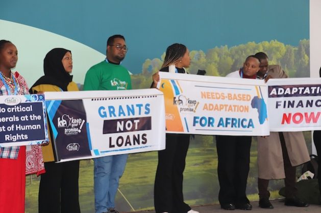 Protesters at COP29 call for climate justice. Credit: Isaiah Esipisu/IPS