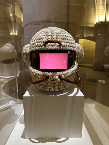 A piece from Emo de Medeiros’s series Vodunaut in the “Revelation! Contemporary art from Benin” exhibit in La Conciergerie in Paris, France. The smartphones within the cowry shell-decorated helmets feature videos taken on four different continents. Credit: Megan Fahrney/IPS