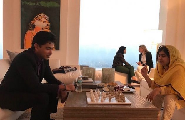 Pop singer and education activist Shehzad Roy plays chess with Malala Yousafzai. Courtesy: Shehzad Roy
