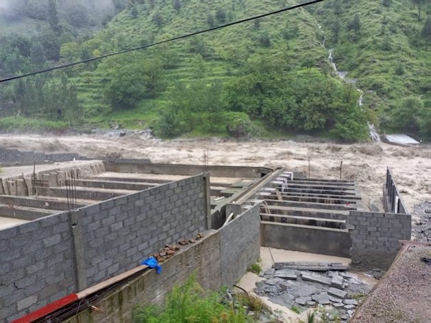 A trout fish farm severely damaged by the catastrophic floods of 2022 is being partially reconstructed by its owner to restart operations. Climate-induced disasters have dealt a severe blow to trout fish farming in Pakistan. Credit: Adeel Saeed/IPS