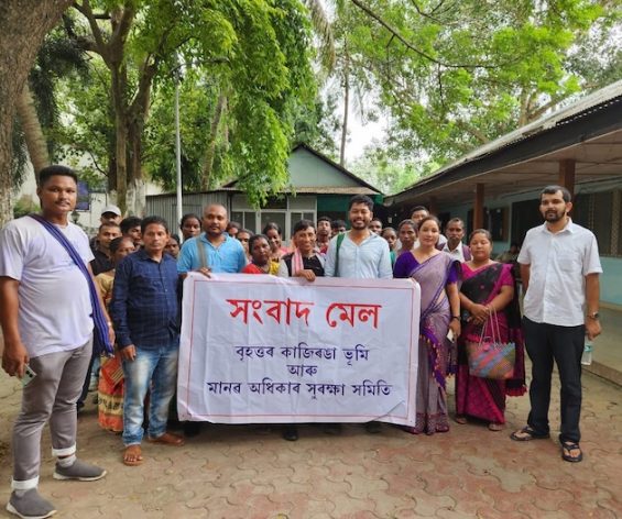 A scene after the Press Conference by Greater Kaziranga Land and Human Rights protection committee with people holding the Press Conference banner. Credit: Pranab Doyle