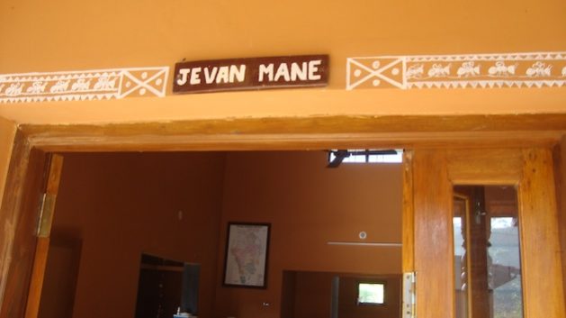 Lingadbael homestay dining hall with its doorway decorated with an illustration of crawling ants, which are ground to make the traditional “saavli” chutney. Credit: Rina Mukheerji/IPS