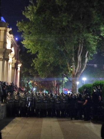 Police line up at an anti-government outside the parliament building in Tbilisi. Credit: Gvantsa Kalandadze
