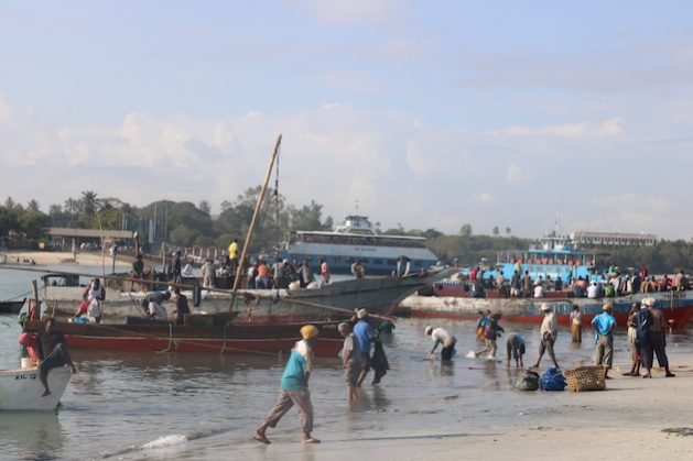 Fishers at Magogoni fish market. Credit: Kizito Makoye/IPS