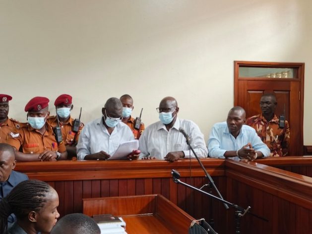 Opposition leader Dr. Kizza Besigye and co-accused Obeid Lutale before a civilian court in Kampala. They have been in jail since they were abducted from Kenya by Uganda's security forces. Credit: Wambi Michael/IPS