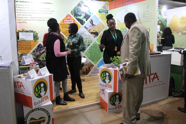 Harriet Okech, a scientist at the International Institute of Tropical Agriculture (IITA), briefing visitors to CGIAR Science Week on the work of the IITA. Credit: Busani Bafana/IPS
