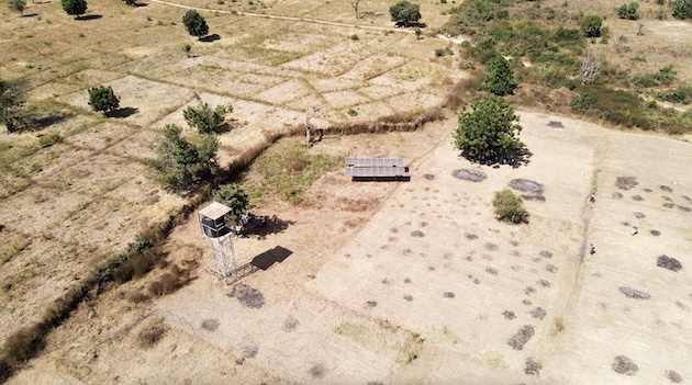A farmer in Gampela uses solar panels and a water tank to irrigate crops during dry weather. Debates about innovative finance for climate-smart projects are under the spotlight at the Africa Climate Summit 2. Credit: Robert Kibet/IPS
