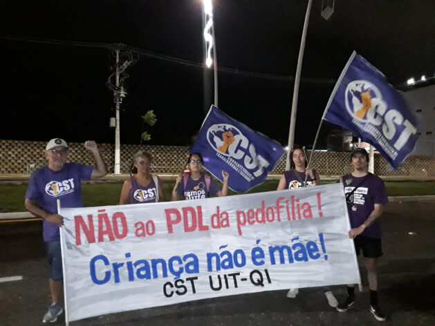 Members of the CST UIT-QI, which refers to the Corrente Socialista dos Trabalhadores (CST) or socialist chain of workers, protesting on Tuesday night outside the COP30 venue. Credit: Joyce Chimbi/IPS