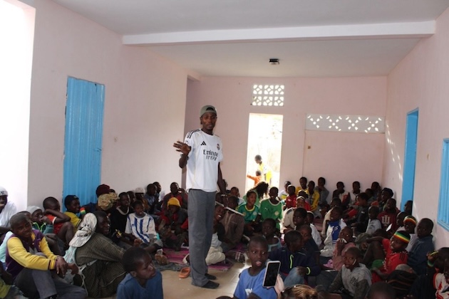 Mamadou Ba, president and founder of Maison des Talibés, speaks to talibés in Saint-Louis, Senegal, at the opening ceremony of the organisation's centre on Jan. 1, 2026. Courtesy: Ramata Haidara