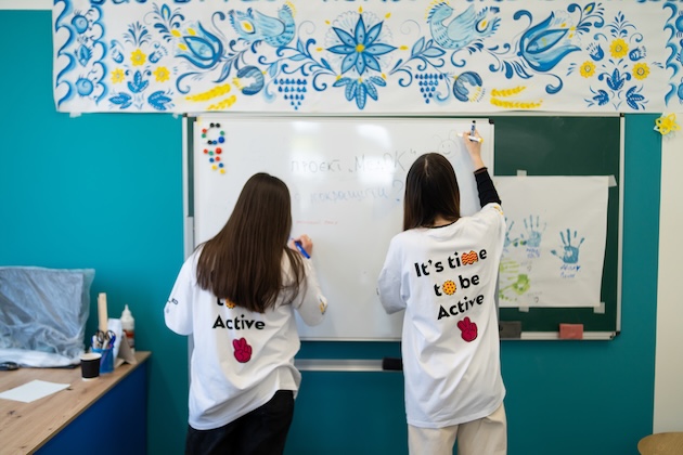 Children participate in UActive programmes which include rebuilding infrastructure damaged in the war. Credit: UActive