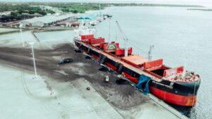 A bulk carrier takes on vast loads of coal at Mtwara Port in southern Tanzania – an image that underscores the stubborn grip of fossil fuels even as global negotiators push for a Net-Zero Framework to steer shipping toward cleaner energy. Credit: Kizito Makoye Shigela/IPS