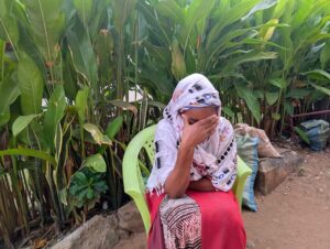 Salima Kitwana, a resident of Dar es Salaam, holds her head in anguish as she speaks about the disappearance of her son Hemedi, a moment that captures the deep uncertainty and pain endured by families still searching for answers. Credit: Kizito Makoye/IPS