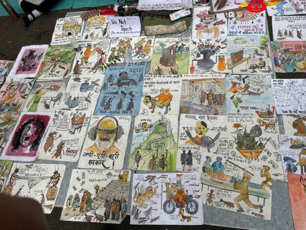 Student-made posters and artwork line the streets of Jantar Mantar, capturing messages of resistance and hope. Aishwarya Bajpai/IPS