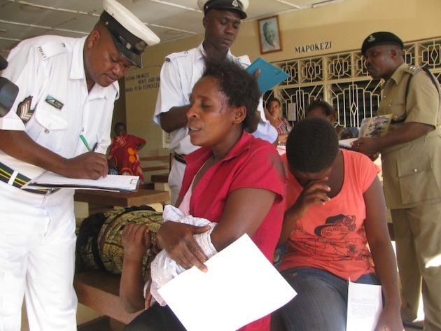 Traffic police take statements from road crash victims at a health facility in Morogoro Region, Tanzania. The country's Basic Emergency Care (BEC) programme is strengthening the capacity of frontline health workers to provide life-saving treatment during the critical moments following serious injuries. Credit: Muhidin Issa Michuzi