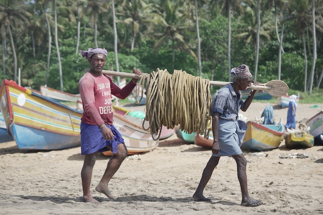 Two fishers at work in Thiruvananthapuram, Kerala, India. Fisheries is a socially and economically important sector for India. Credit: Bharath Thampi/IPS