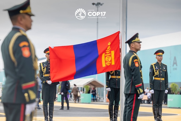 Mongolian ceremonial guards stand beside the national flag during the opening of UNCCD COP17 in Ulaanbaatar on Aug. 17, 2026. The conference is focused on accelerating global action on land restoration and drought resilience. Credit: UN photo