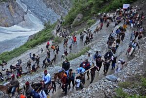 For generations, Kashmir's Muslims have formed the backbone of the Amarnath pilgrimage. Pony handlers transport elderly pilgrims over steep mountain paths. Porters carry luggage and children across dangerous terrain. Credit: Umar Manzoor Shah/IPS