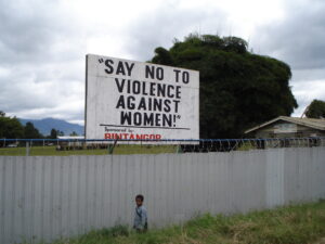 A public streetside sign advocates against gender-based violence in the Highlands of Papua New Guinea. Credit: Catherine Wilson/IPS