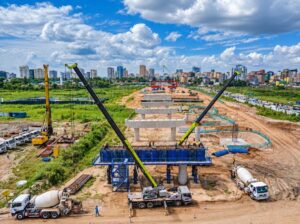 Construction work on the new Jangwani bridge across the flood-prone Msimbazi valley in Dar es Salaam. The elevated road is designed to keep traffic moving when heavy rains inundate the area. Credit: Kizito Makoye/IPS