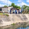 Tanzania’s vice-president inspects a drainage channel in Dar es Salaam as authorities step up preparations for heavy El Niño rains expected during the October–December rainy season. Credit: Kizito Makoye/IPS