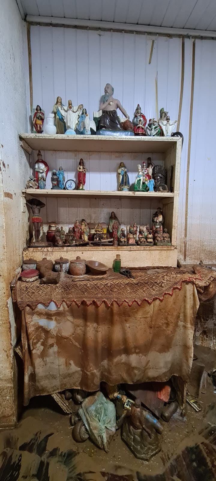 Lutalo Canti lost religious objects, including ceremonial clothing and sacred figures, in a severe flood. Credit: Lutalo Canti 