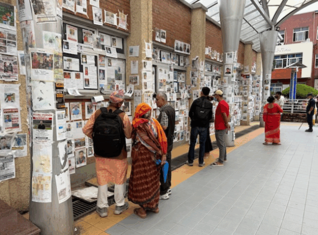 Photos of the Rasuwa flood missing line the walls of the Teaching Hospital, Tribhuvan University. Credit: Brandon Kohrt