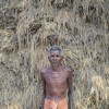 Orissa share farmer Gundicha Rout beside his blackened crop. Credit: Manipadma Jena/IPS