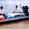 Missionary pilot Kevin Donaldson receiving first aid after crash-landing in the Amazon river.  Credit: Courtesy of La República
