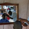 A makeshift barbershop in the Petionville Club, where 50,000 displaced Haitians have set up camp. It also features beauty salons and a market. Credit: UN Photo/Sophia Paris