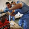 A young earthquake victim is treated at an impromptu hospital established by the Jordanian battalion of the U.N. peacekeeping mission. Credit: UN Photo/Sophia Paris