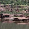 What remains of the Peruvian village of Piñipampa emerges from the water.  Credit: Roberto Guerrero/Courtesy of Oxfam