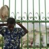 A young boy silently prays in front of the Presidential Palace on the one-month anniversary of Haiti's devastating earthquake. Credit: UN Photo/Sophia Paris