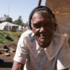 An elderly woman seeks refuge from post-election violence at Nakuru Internally Displaced Camp in February 2008.  Credit: Dolphin Emali/IPS