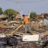 Searching through the rubble in Ojos del Mar, a tourist destination in the Valparaíso region of Chile that was hit by the tsunami.  Credit: Fernando Fiedler/IPS