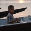 This Lao boy came back from a fishing trip with his father -- with just one small fish as the day's catch.  Credit: Vannaphone Sitthirath/IPS