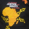 A slogan seen on t-shirts at the meeting. Credit:  Servaas van den Bosch/IPS