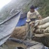 Small-scale miner next to cyanide leaching pit. Credit: Milagros Salazar/IPS