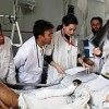 Italian surgeon Marco Garatti (extreme right, holding x-ray).  Credit: Emergency