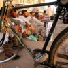 Painters, who are among Pakistan's daily wage earners, wait on the roadside for someone to hire them. Credit: Fahim Siddiqi/IPS