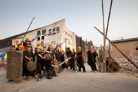 Villagers at Caochangdi, home to China's prominent artists and galleries, stage a mock protest against the planned demolition of their suburb.  Credit: James Wasserman/IPS