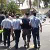 Free Gaza activists being marched away from a bus at the Ben Gurion International airport.  Credit: Mel Frykberg/IPS