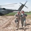 Gen. Stanley A. McChrystal (left) crosses a poppy field to Forward Operating Base Camp Dwyer in Marja.  Credit: U.S. Navy