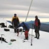 Scientists take samples from the Antisana glacier. In the background is the active Cotopaxi volcano. Credit: Courtesy of Bernard Francou/IRD
