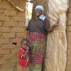 Esther Sakala outside the Skyloo toilet she constructed herself. Credit:  Dingaan Mithi/IPS