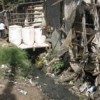 Lack of space has forced people in Korogocho slum, situated near Nairobi's Dandora dump site, to trade above open sewers.  Credit: Isaiah Esipisu/IPS