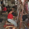 Tibetan women weaving carpets at Jawalakhel Handicraft Center in Kathmandu. Credit: Bhuwan Sharma/IPS