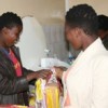 Some of the AIDS orphans from the hostel preparing food in the kitchen.  Credit: Mantoe Phakathi/IPS