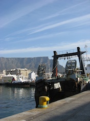 Fishing boats in Cape Town harbour, South Africa, with Table Mountain as backdrop. Credit: Servaas van den Bosch/IPS Fishing boats in Cape Town harbour, South Africa, with Table Mountain as backdrop. Credit: Servaas van den Bosch/IPS
